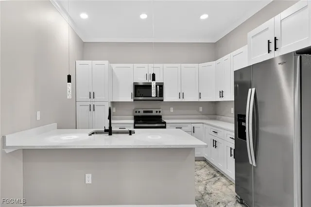 a view of a bathroom with a sink and a mirror
