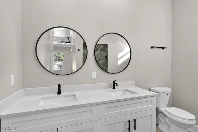 a bathroom with a sink a shower and a mirror