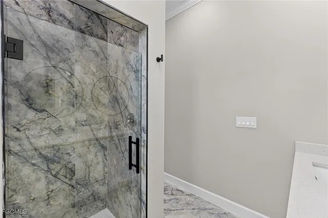 an empty room with a window and a ceiling fan