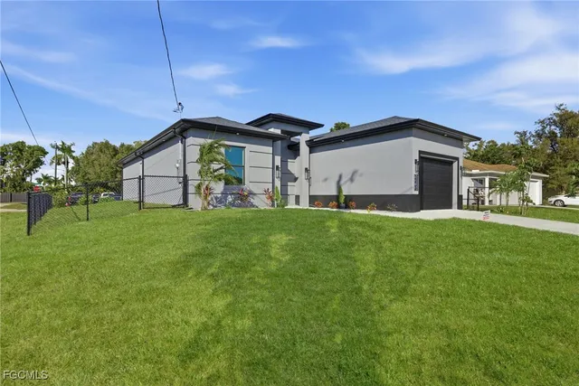 a kitchen with stainless steel appliances a refrigerator sink and microwave