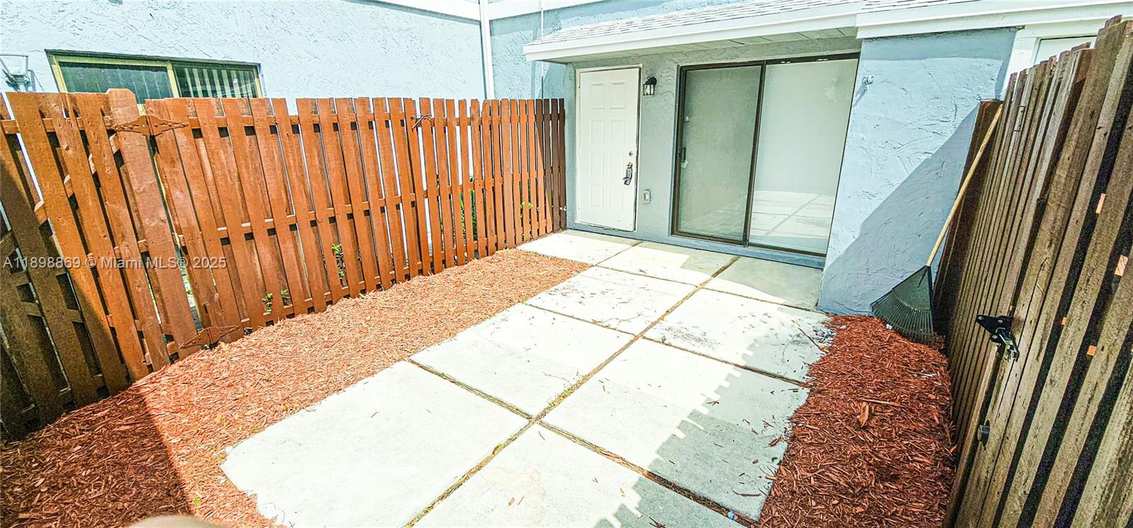 a bedroom with a bed and a wooden floor