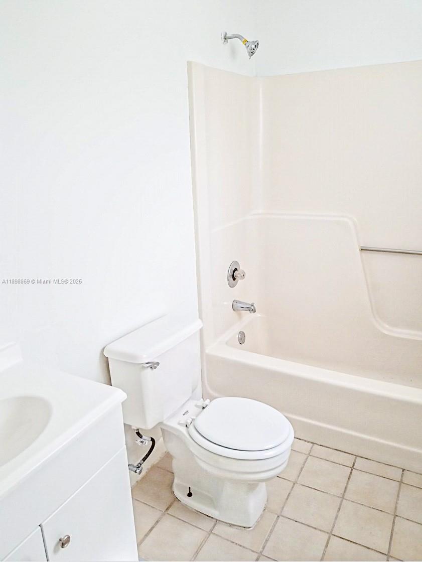11 Crossings Circle, Unit C Boynton Beach, FL 33435 - Photo 11 of 12 a white toilet sitting next to a bath tub