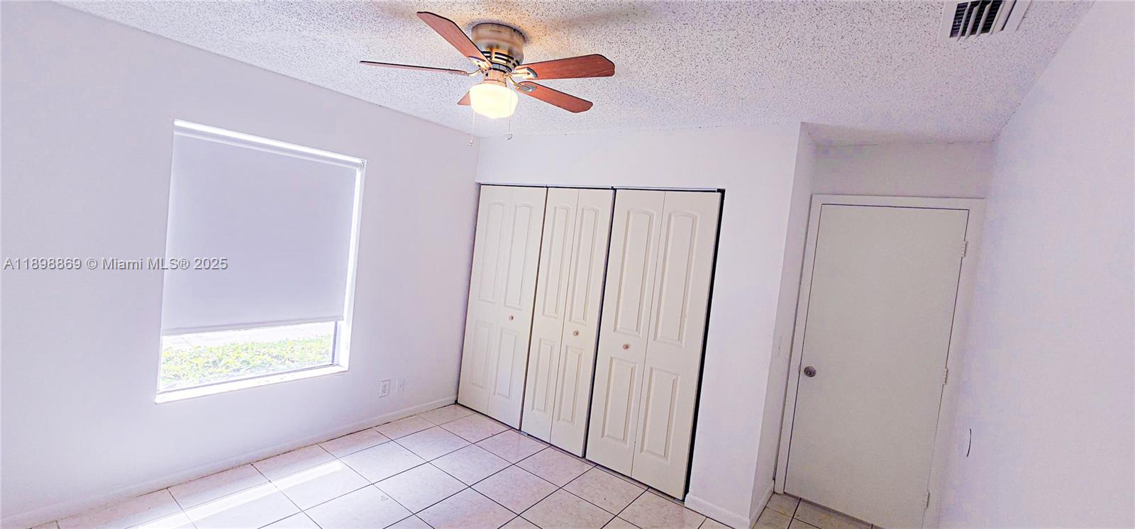 11 Crossings Circle, Unit C Boynton Beach, FL 33435 - Photo 7 of 12 a view of an empty room with a window