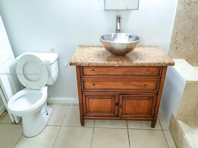 a bathroom with a toilet and a sink