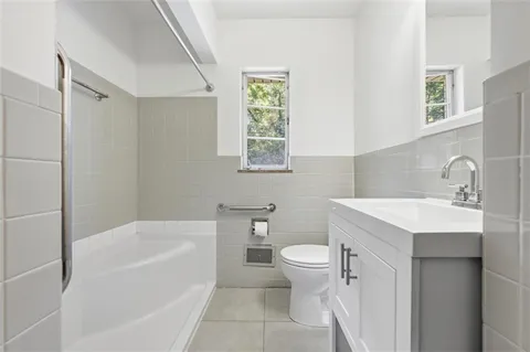 a bathroom with a sink toilet and bathtub