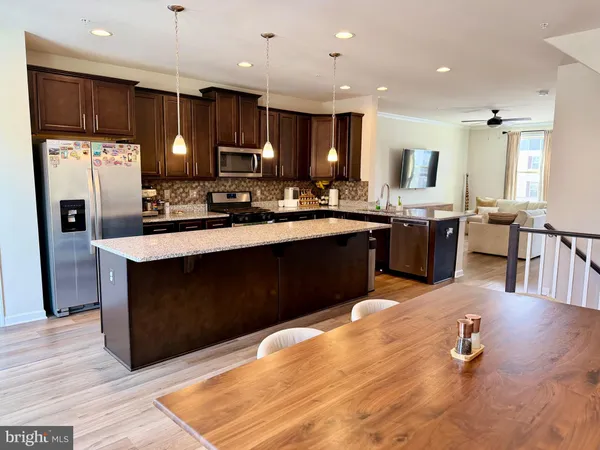 a kitchen with lots of counter top space and appliances