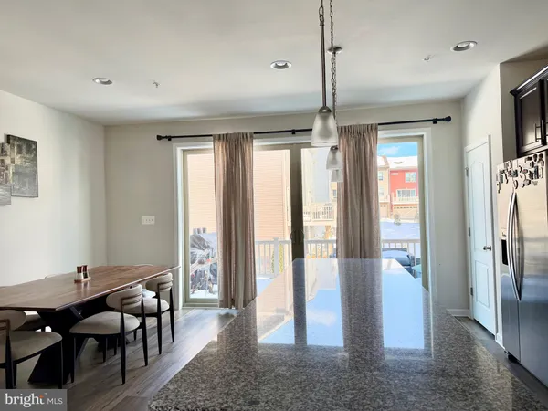 a view of a livingroom with furniture window and wooden floor
