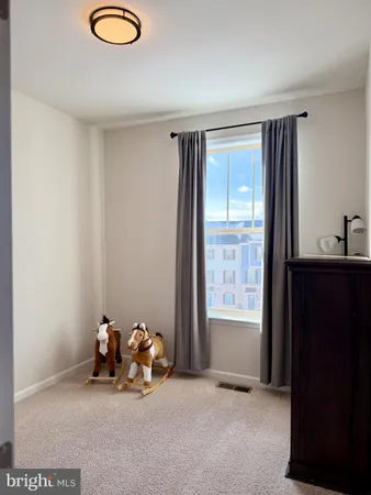a view of a livingroom with furniture and window