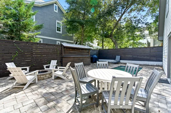 a view of a backyard with sitting area
