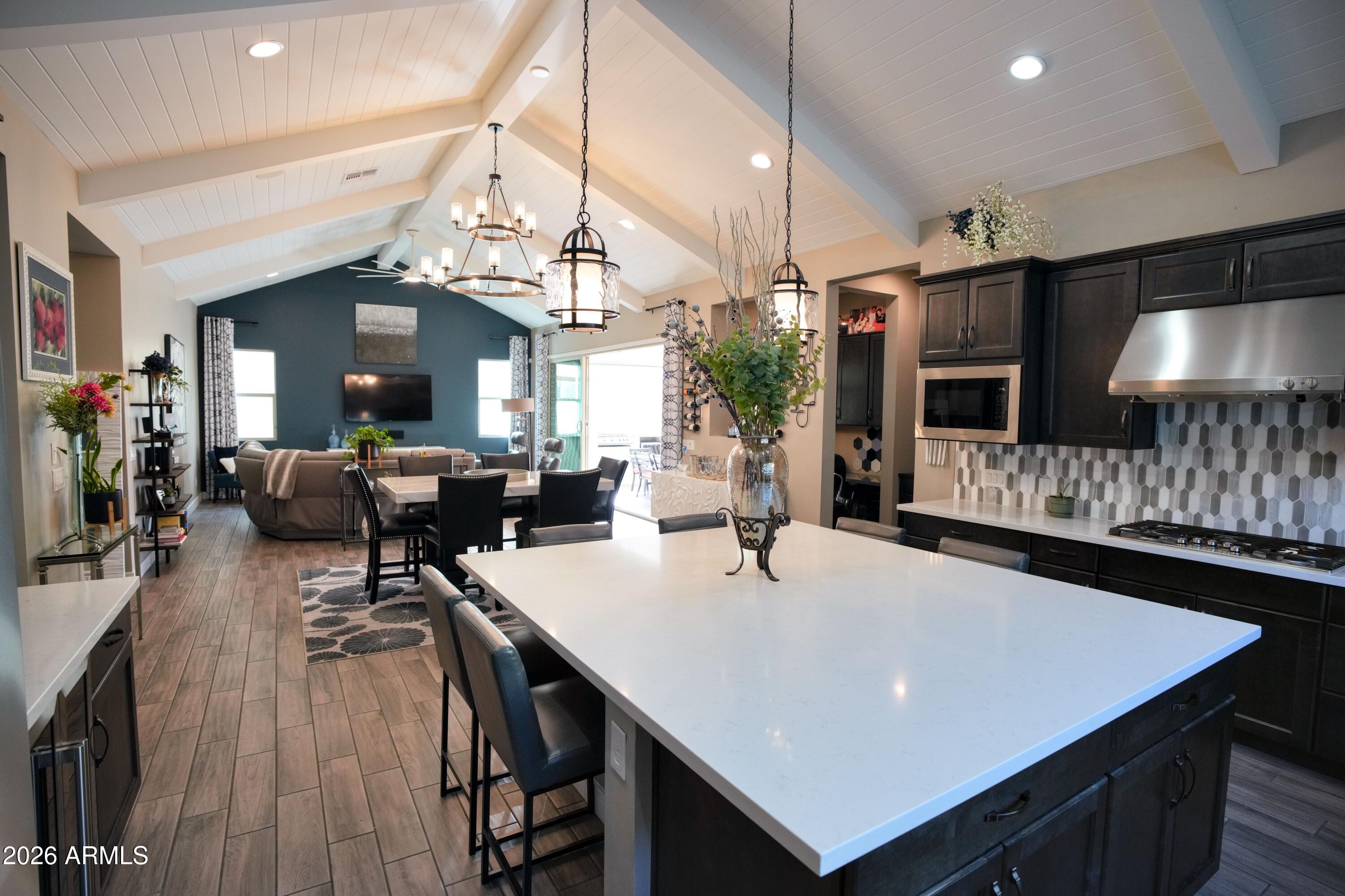20471 West Coolidge Street Buckeye, AZ 85396 - Photo 11 of 41 a view of a dining room with furniture and wooden floor
