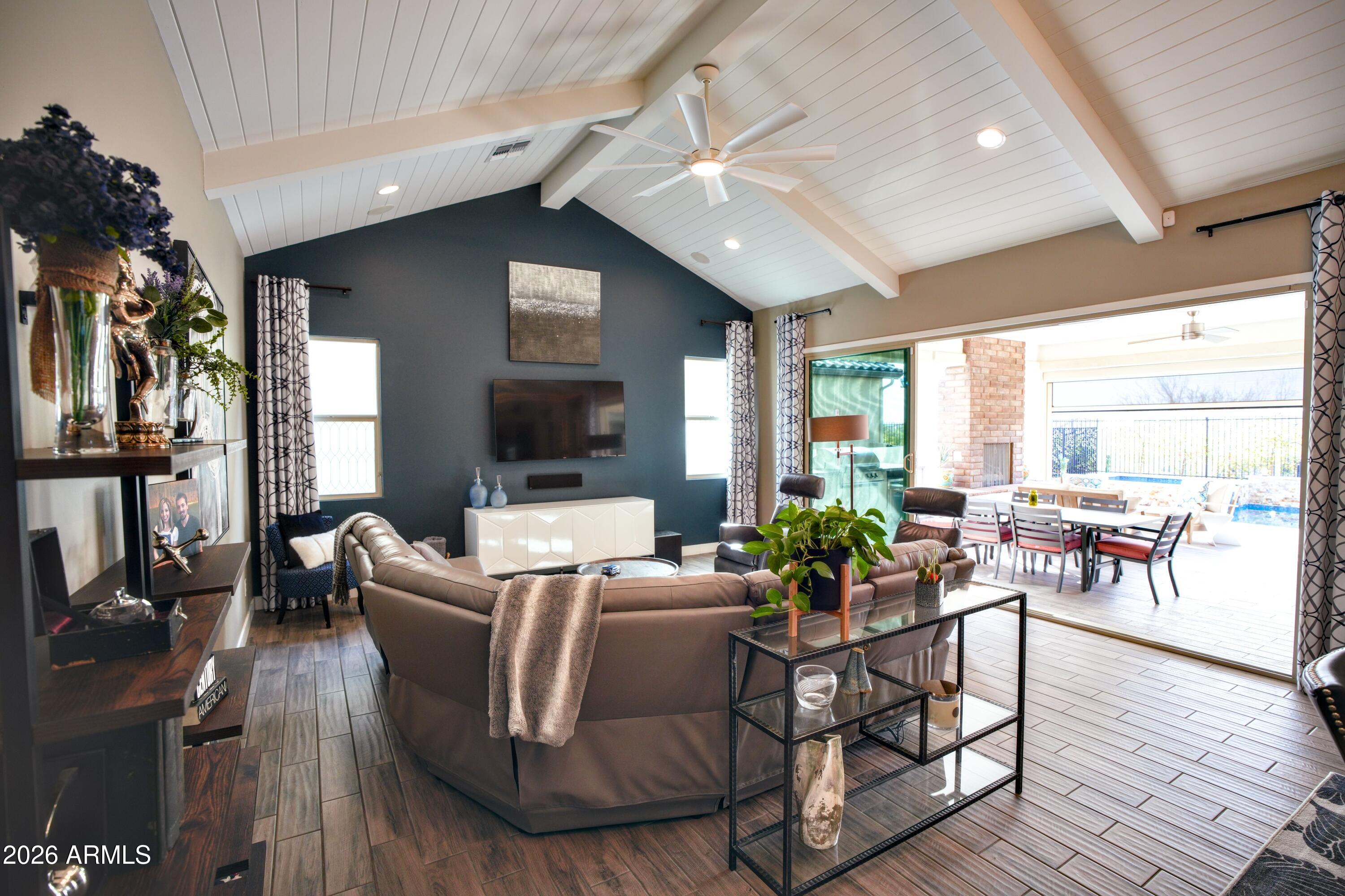 20471 West Coolidge Street Buckeye, AZ 85396 - Photo 15 of 41 a living room with fireplace furniture and a large window