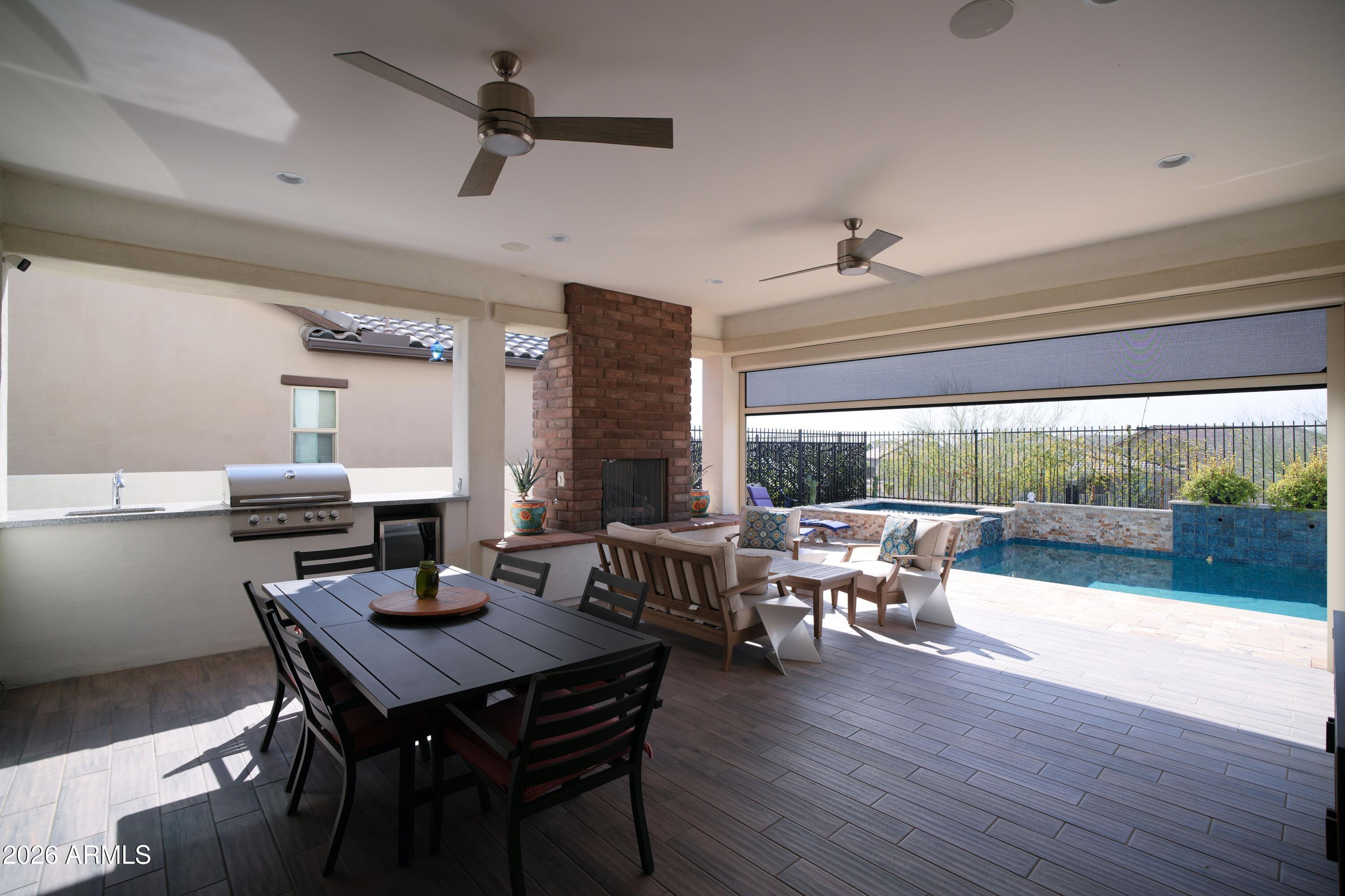 20471 West Coolidge Street Buckeye, AZ 85396 - Photo 16 of 41 a view of a dining room with furniture window and wooden floor
