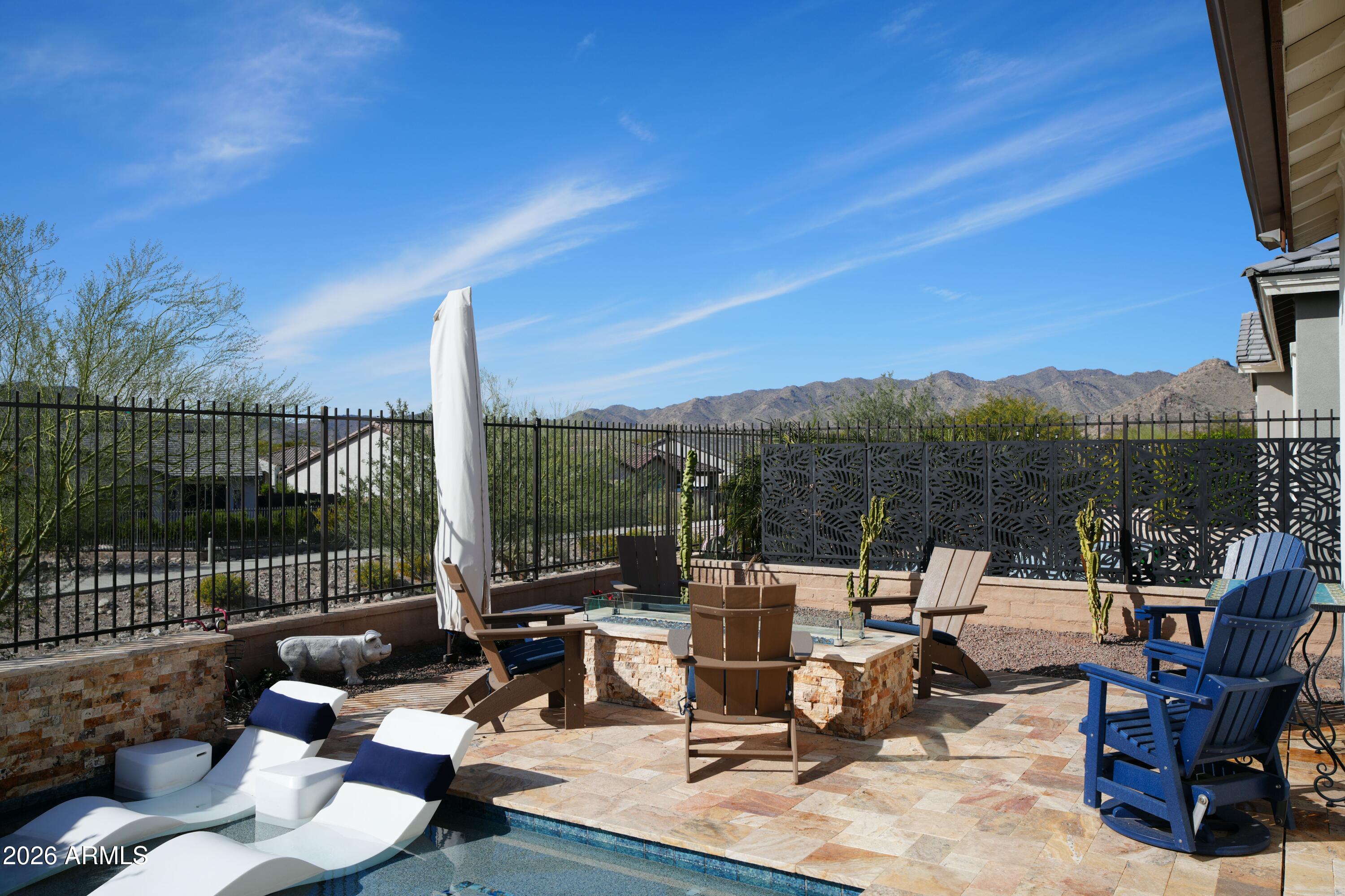 20471 West Coolidge Street Buckeye, AZ 85396 - Photo 19 of 41 a view of a patio with couches chairs and a table and chairs
