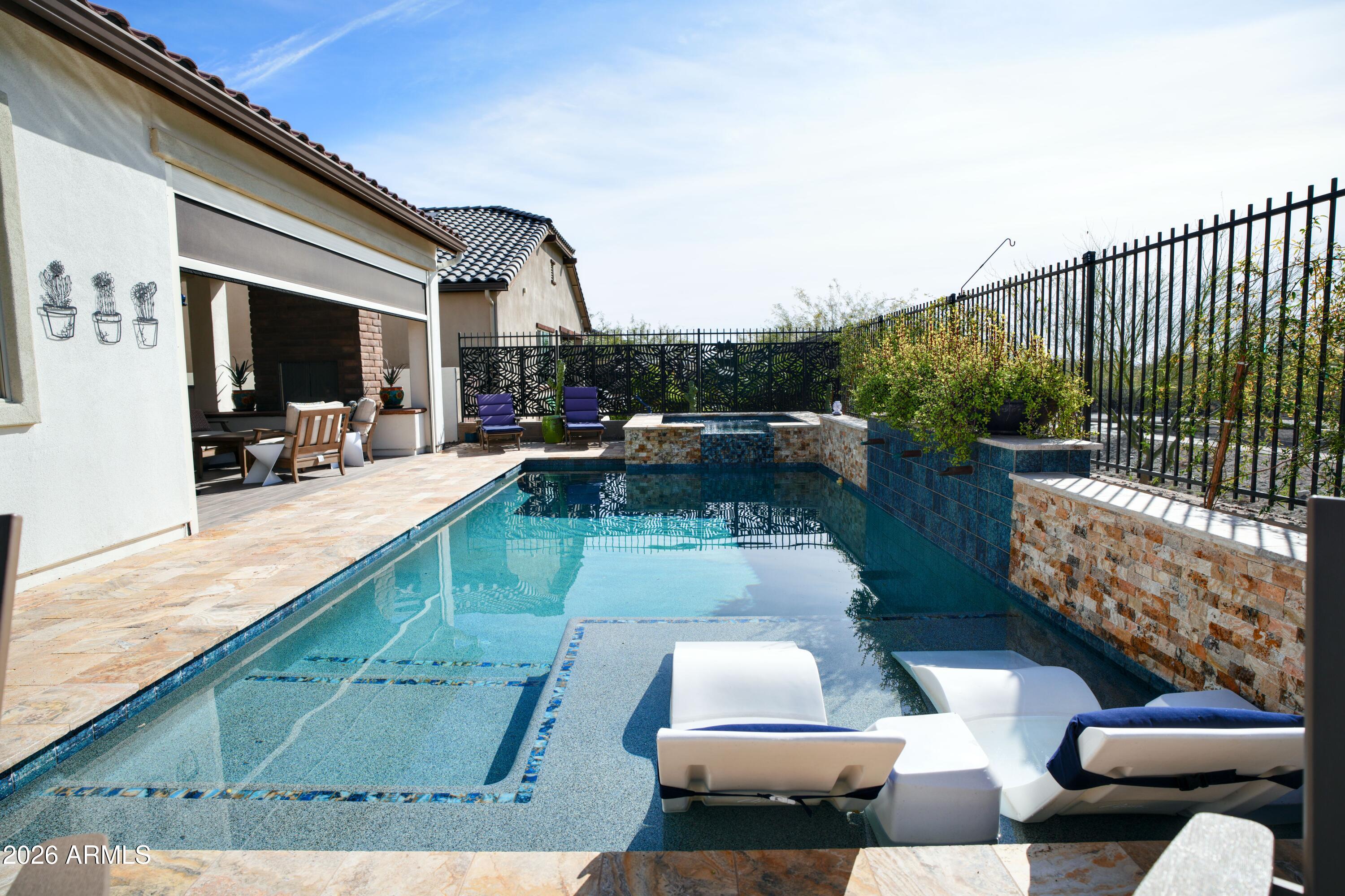 20471 West Coolidge Street Buckeye, AZ 85396 - Photo 20 of 41 a view of a patio with couches and a table and chairs with wooden floor