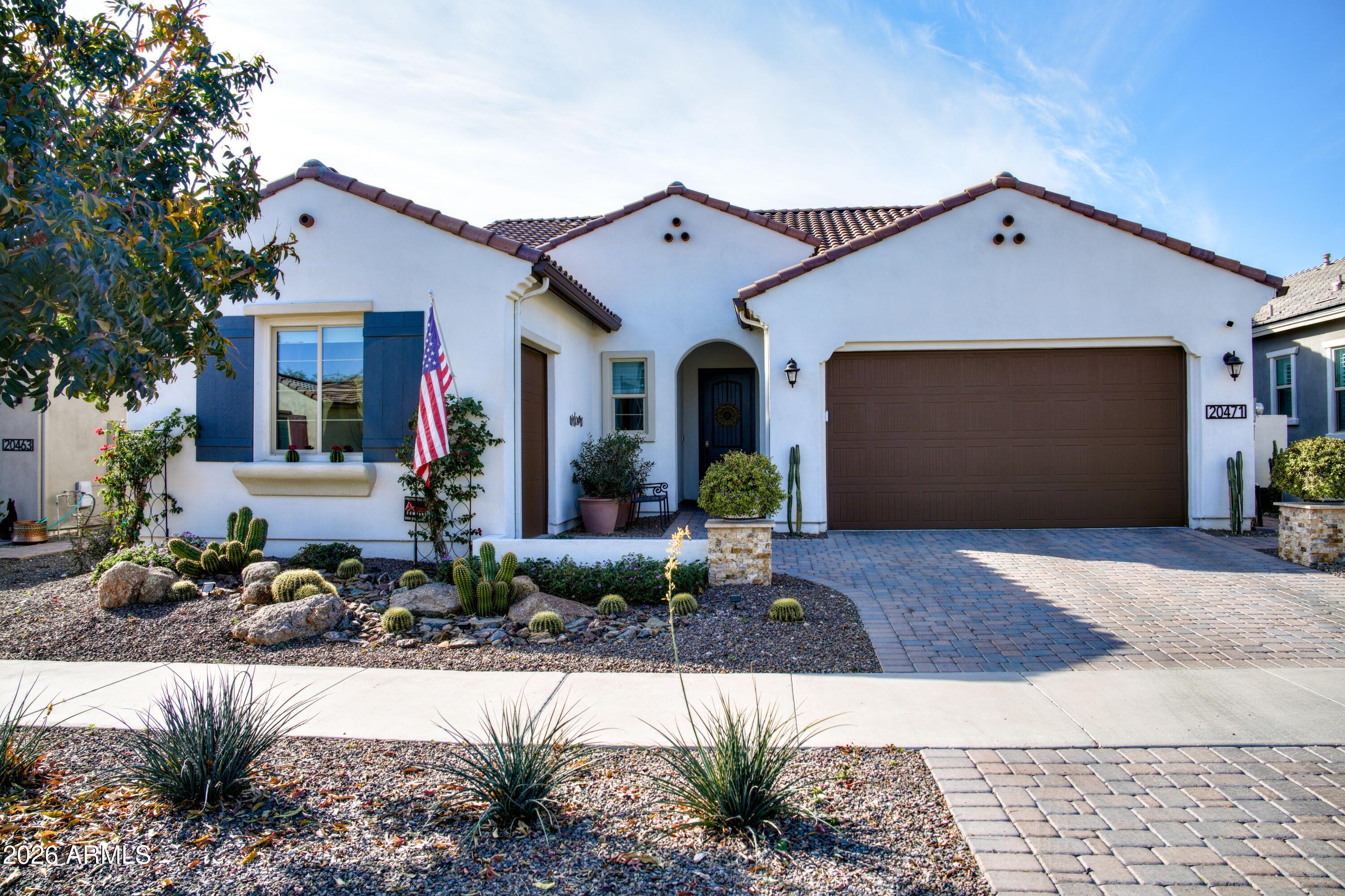 20471 West Coolidge Street Buckeye, AZ 85396 - Photo 2 of 41 a front view of a house with garden
