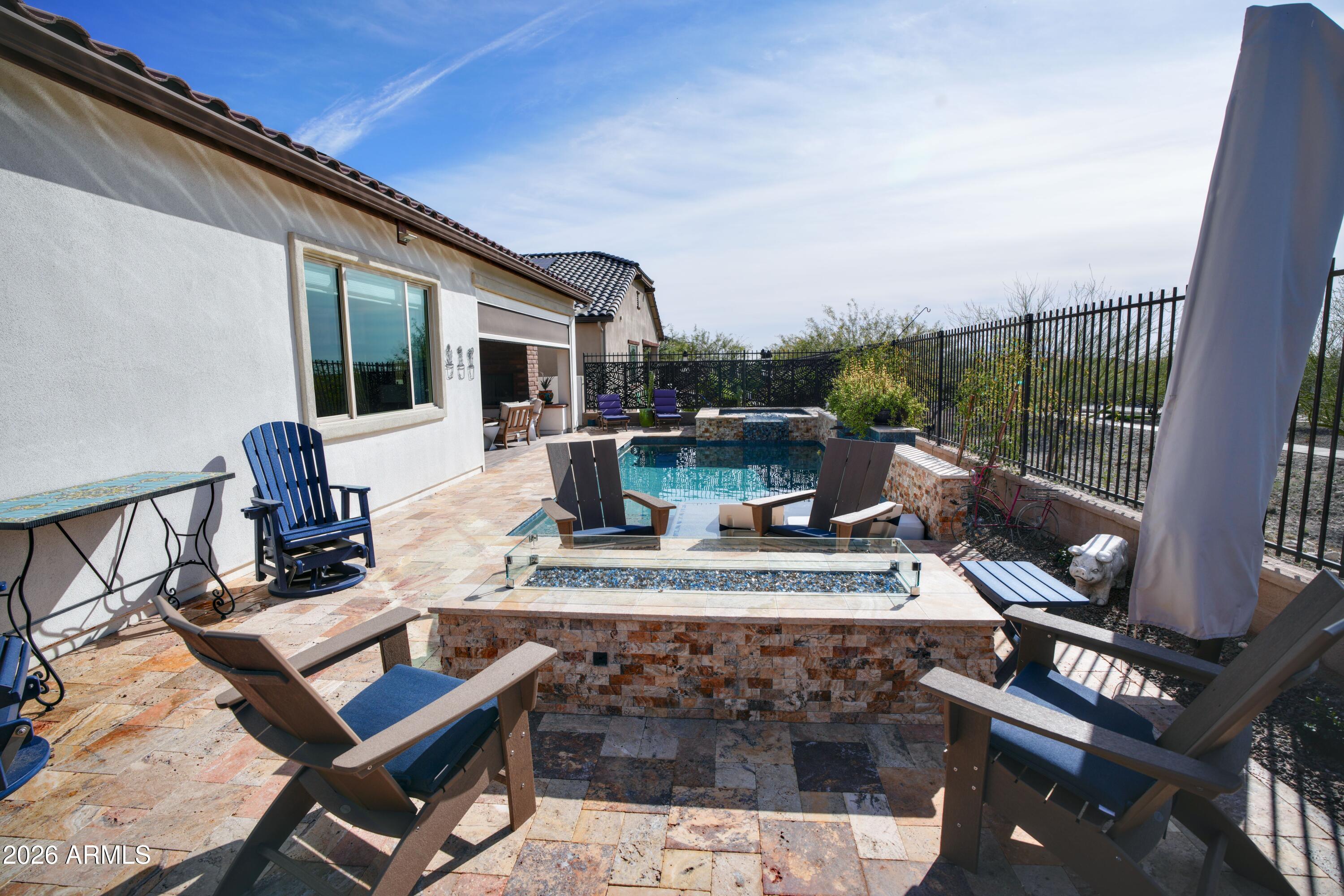 20471 West Coolidge Street Buckeye, AZ 85396 - Photo 21 of 41 a view of a patio with a dining table and chairs with wooden floor