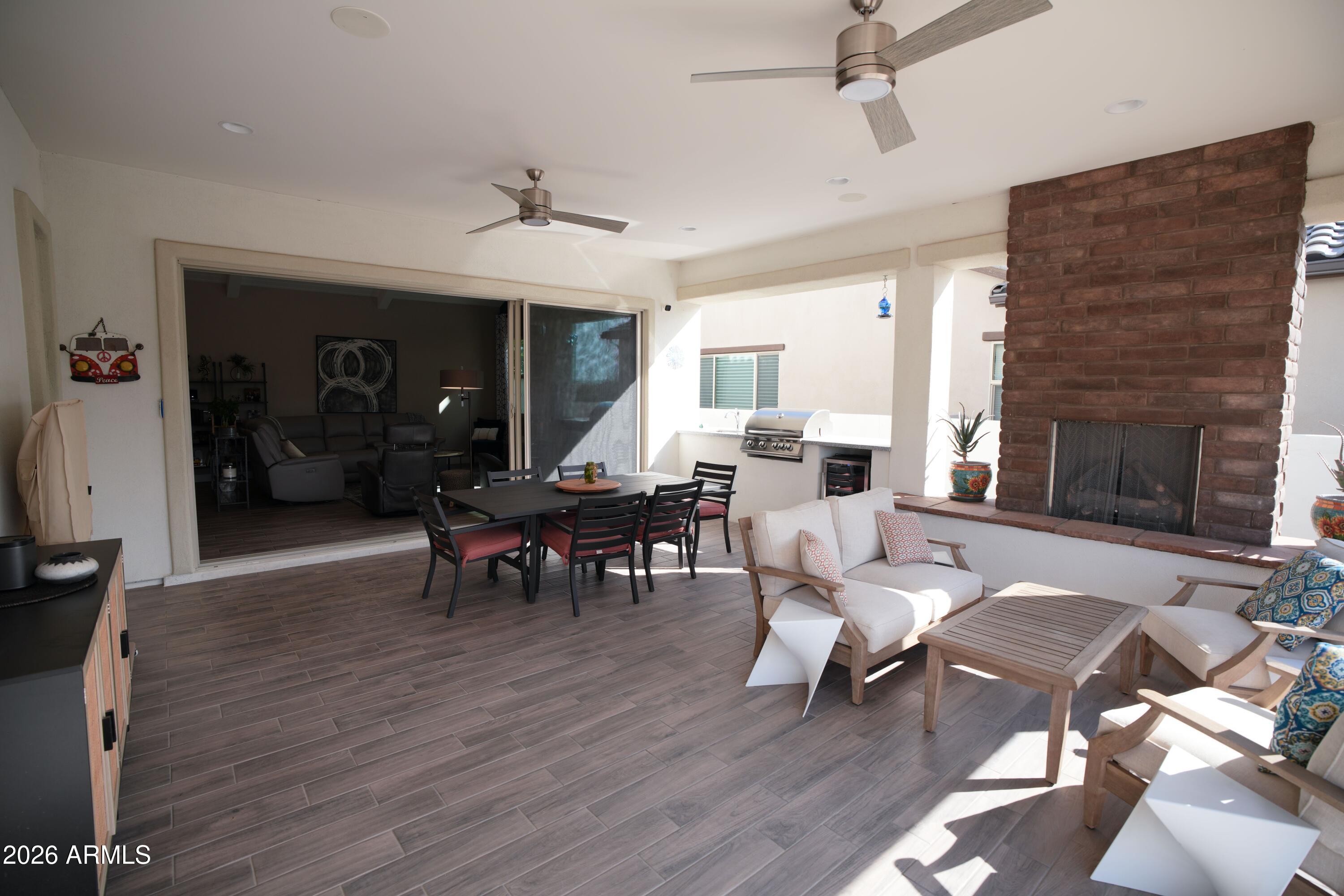20471 West Coolidge Street Buckeye, AZ 85396 - Photo 22 of 41 a living room with furniture dining table and a fireplace