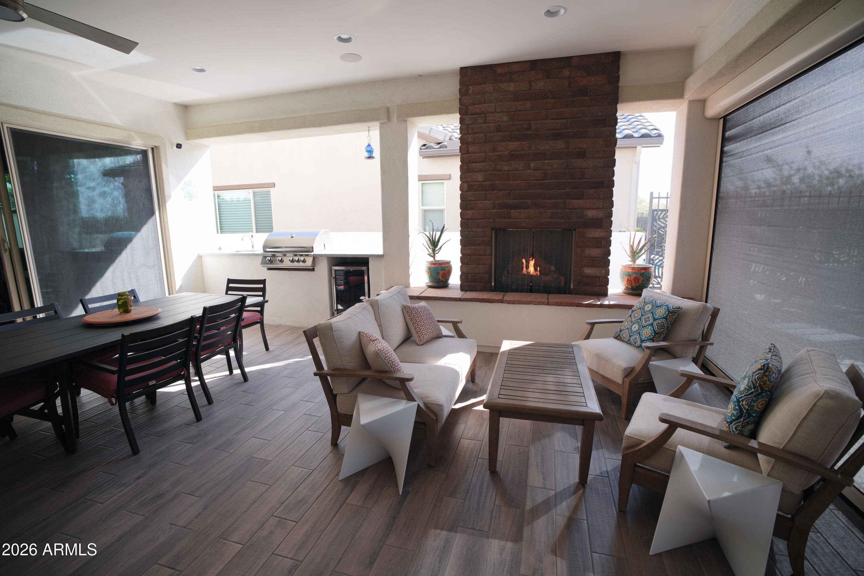 20471 West Coolidge Street Buckeye, AZ 85396 - Photo 24 of 41 a view of a dining room with furniture window and wooden floor