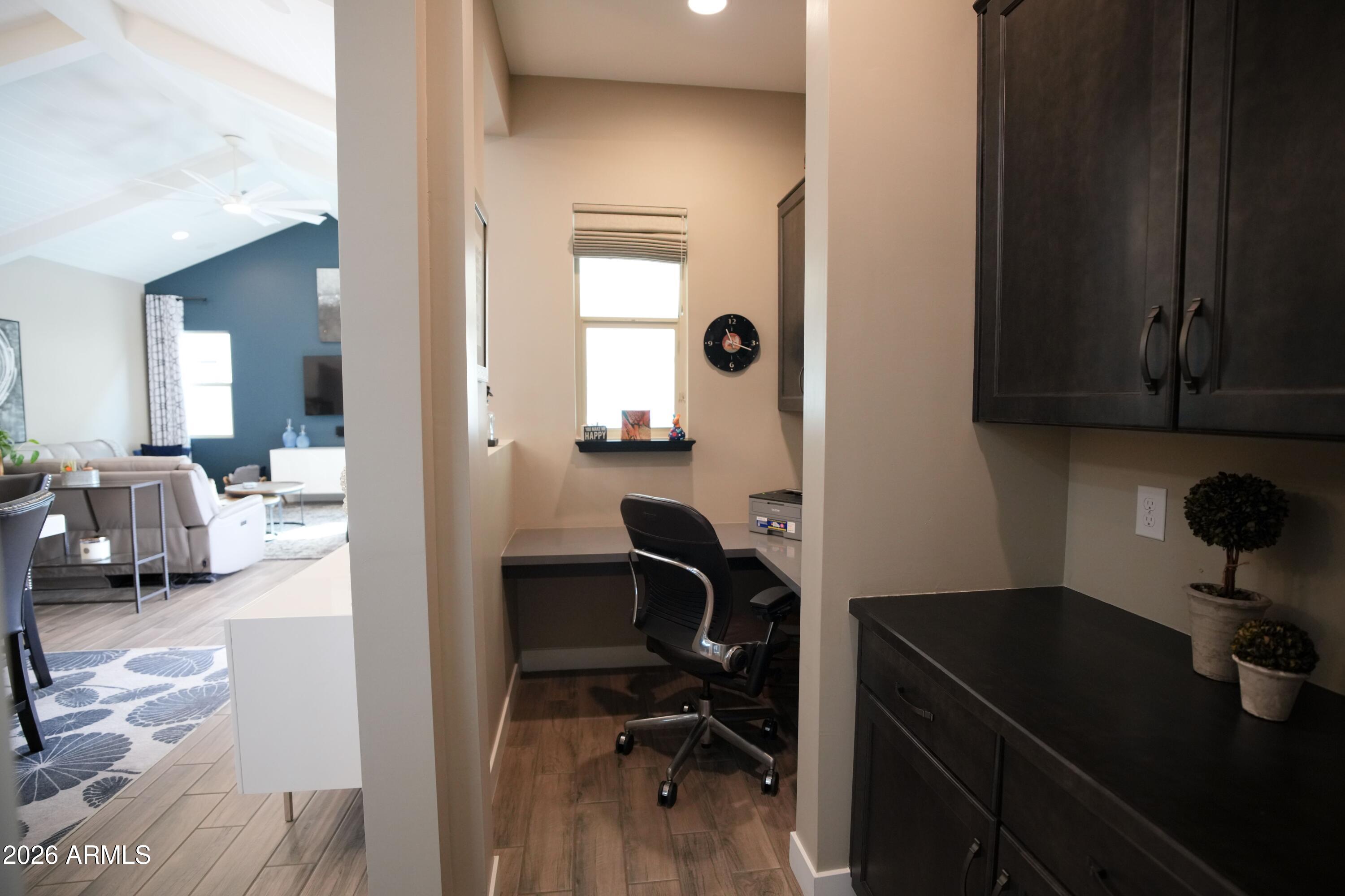 20471 West Coolidge Street Buckeye, AZ 85396 - Photo 26 of 41 a view of a workspace with furniture and a workspace