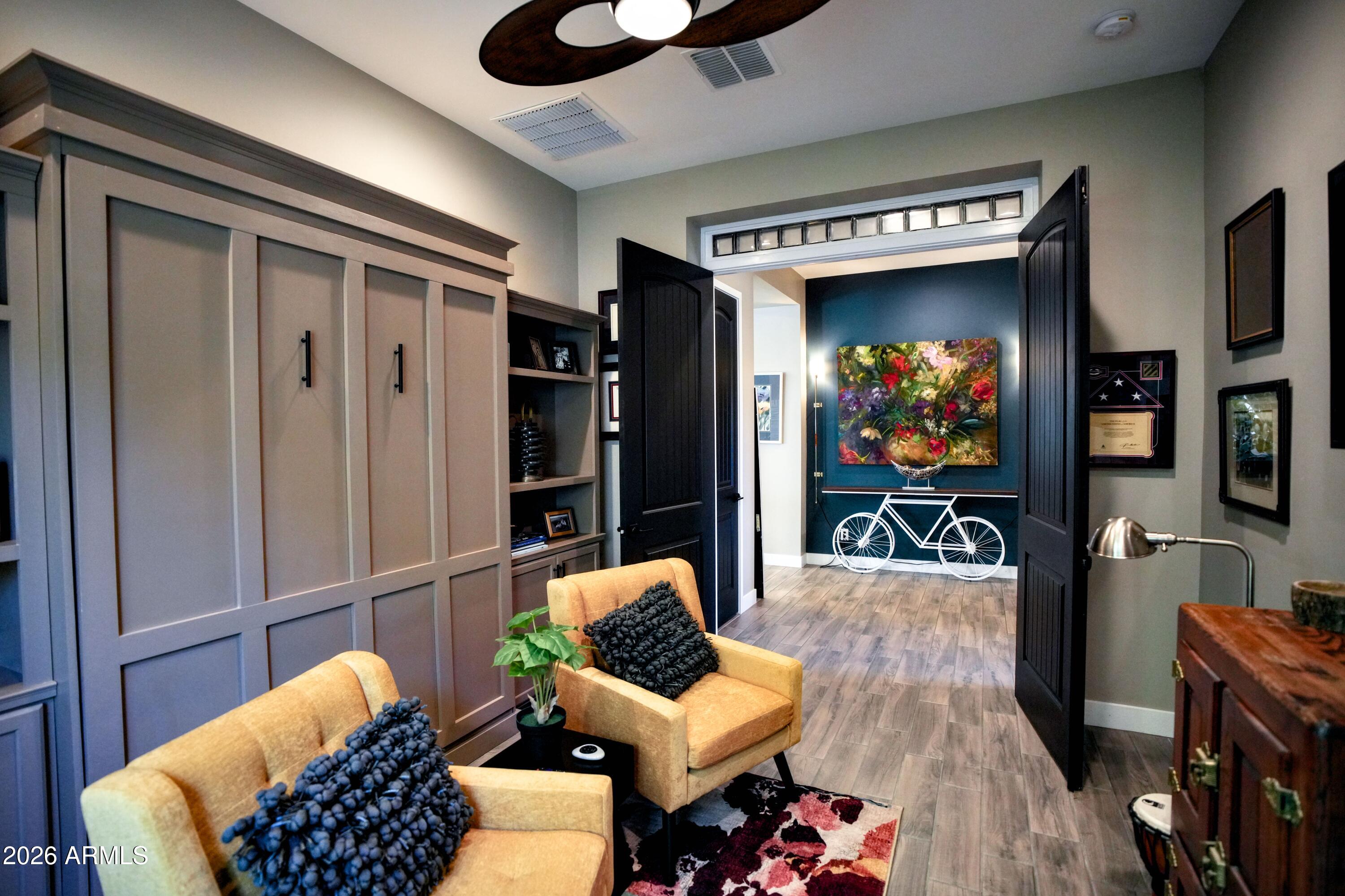 20471 West Coolidge Street Buckeye, AZ 85396 - Photo 37 of 41 a living room with furniture and a flat screen tv