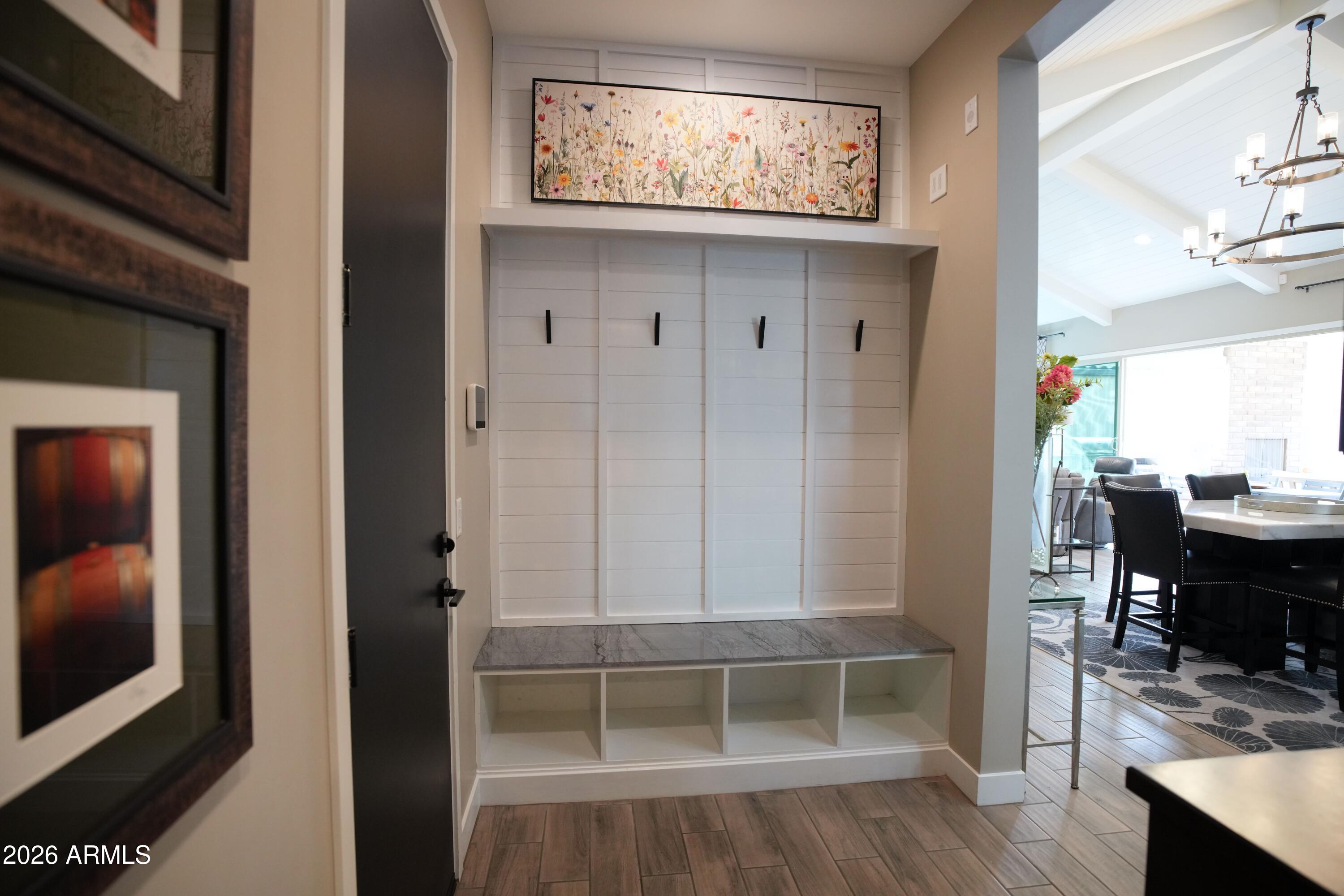 20471 West Coolidge Street Buckeye, AZ 85396 - Photo 40 of 41 a view of a hallway with wooden floor and a bathroom