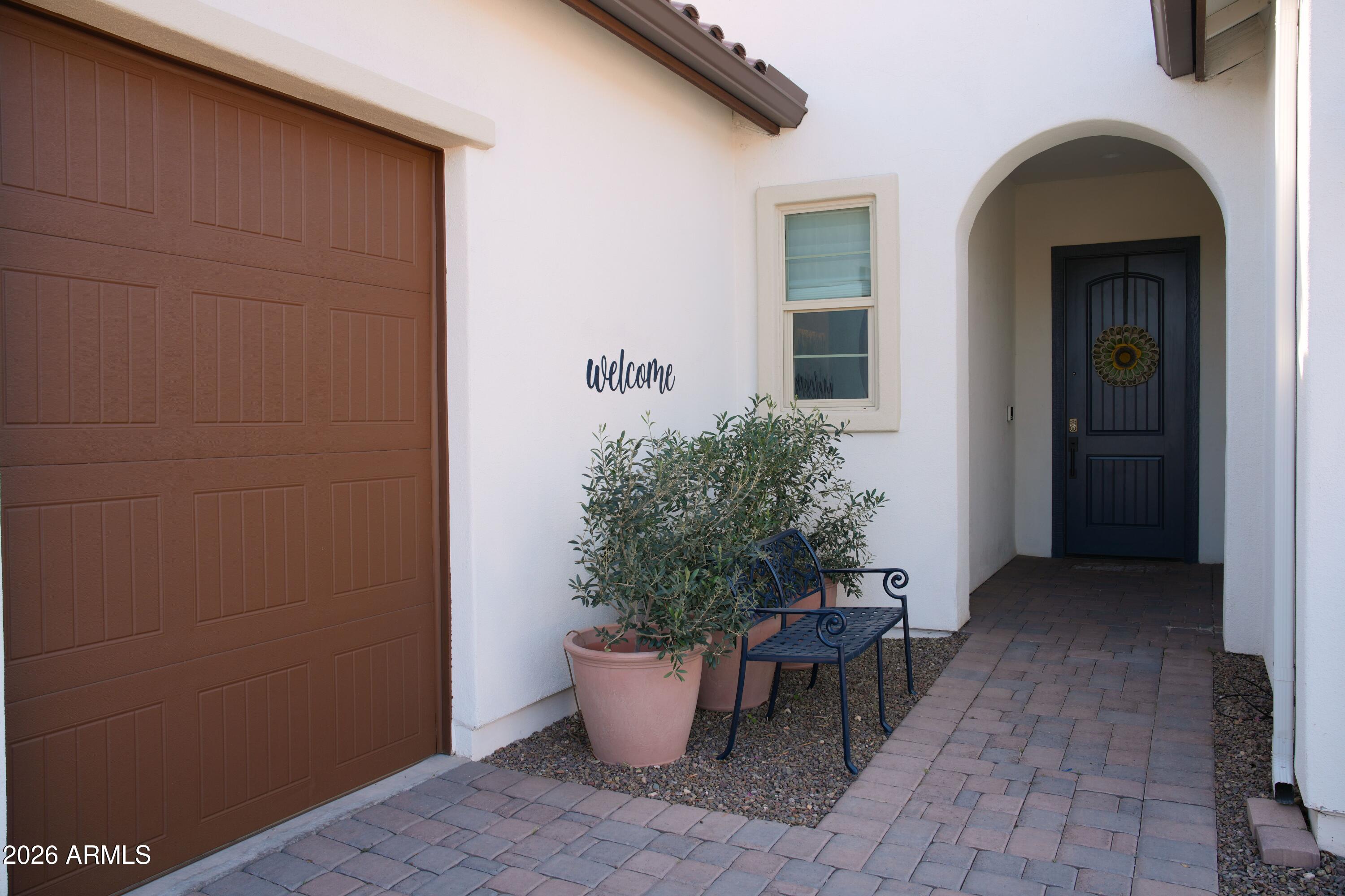 20471 West Coolidge Street Buckeye, AZ 85396 - Photo 4 of 41 a potted plant in front of a door