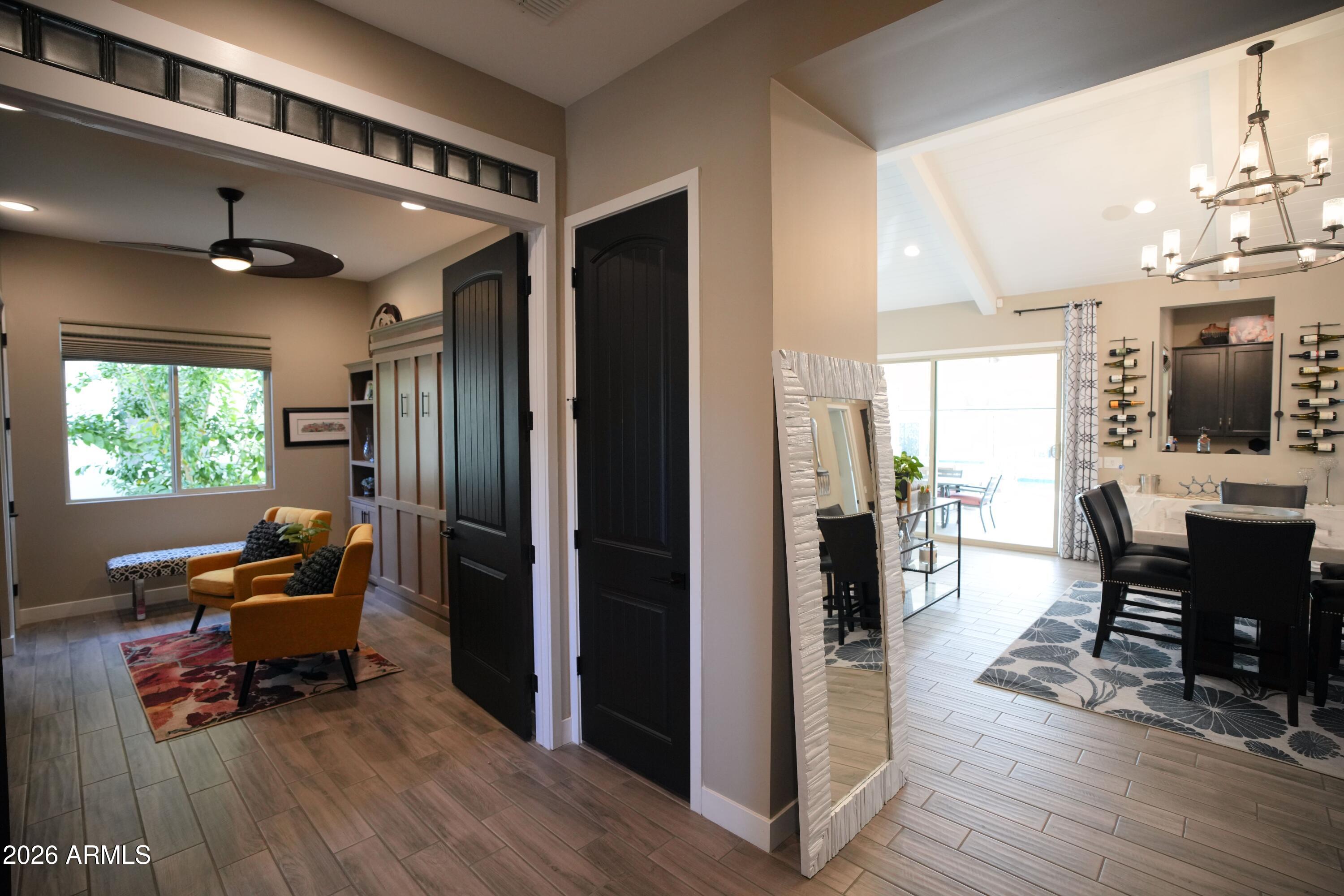 20471 West Coolidge Street Buckeye, AZ 85396 - Photo 5 of 41 a view of a dining room with furniture window and wooden floor