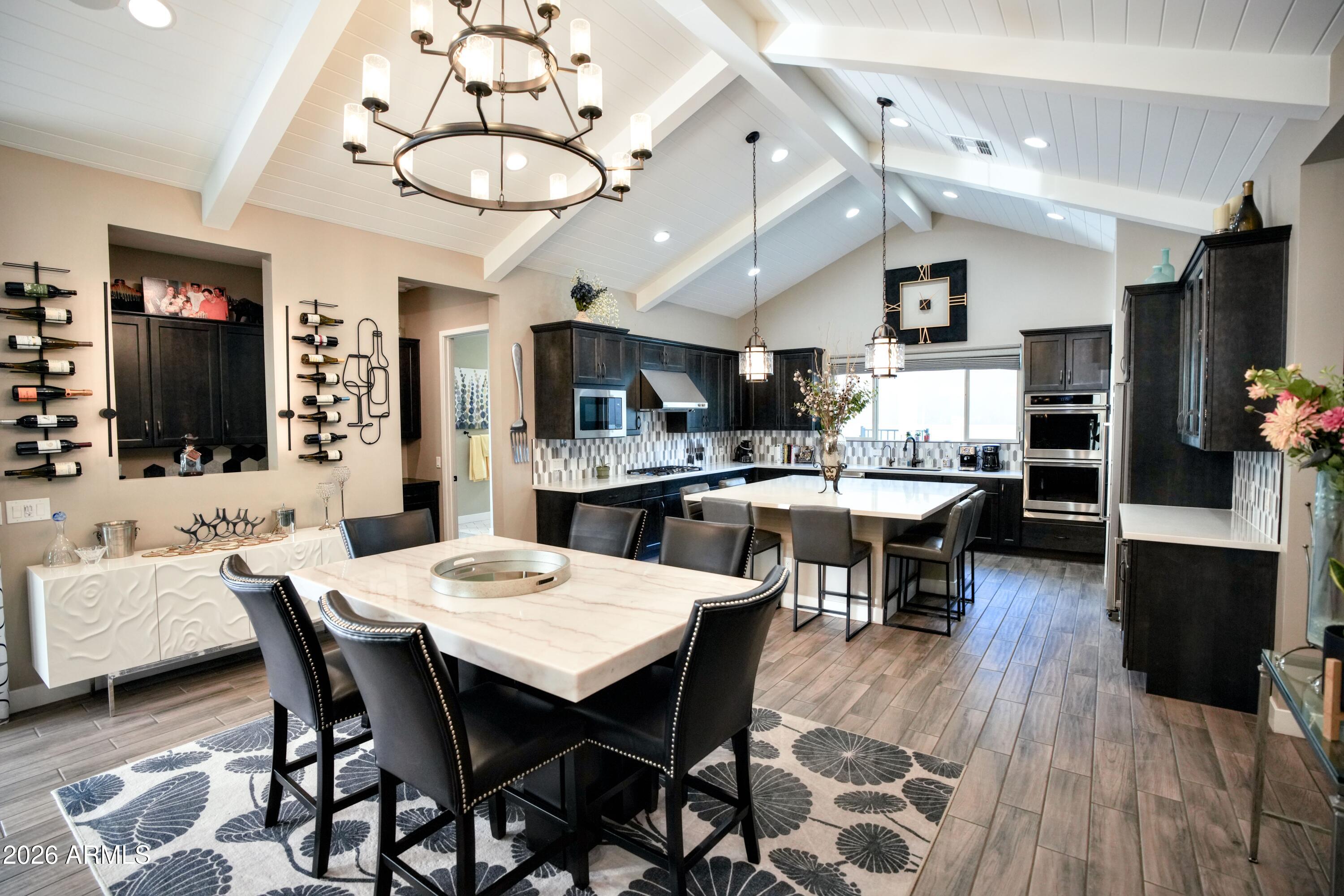 20471 West Coolidge Street Buckeye, AZ 85396 - Photo 6 of 41 a view of a dining room with furniture and wooden floor