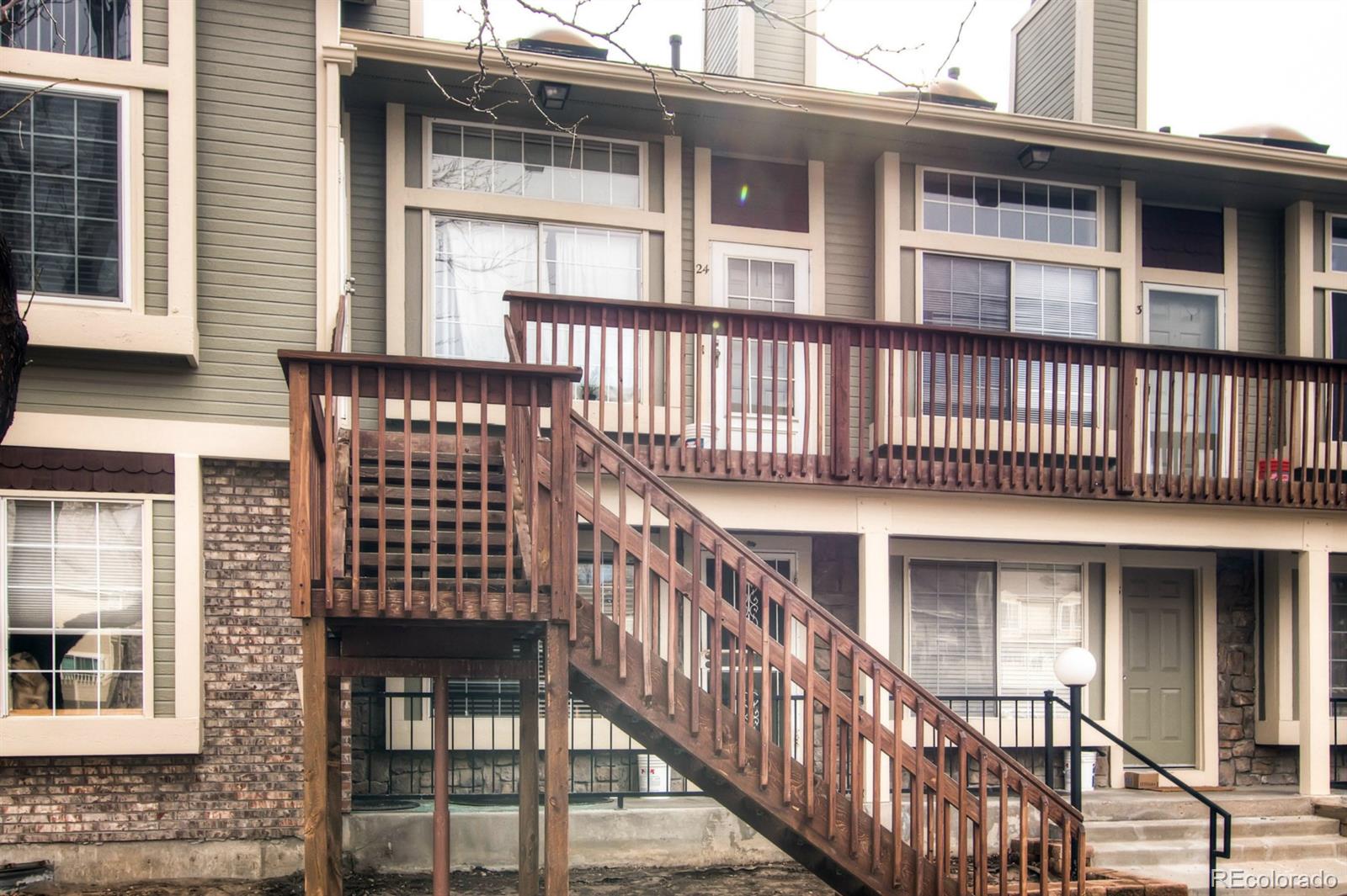 1885 South Quebec Way, Unit 24 Denver, CO 80231 - Photo 1 of 1 a view of a brick house with large windows