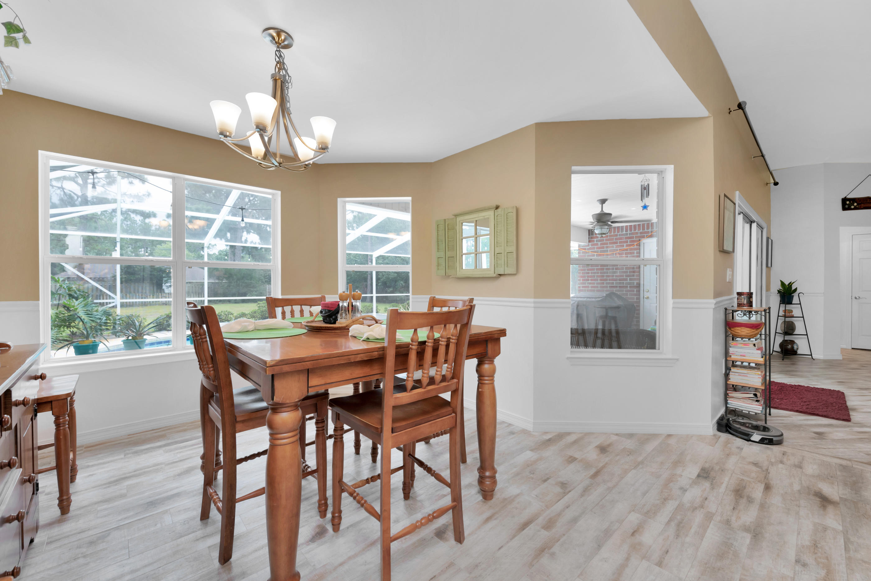 7159 Riverview Road Navarre, FL 32566 - Photo 13 of 36 a view of a dining room with furniture window and outside view