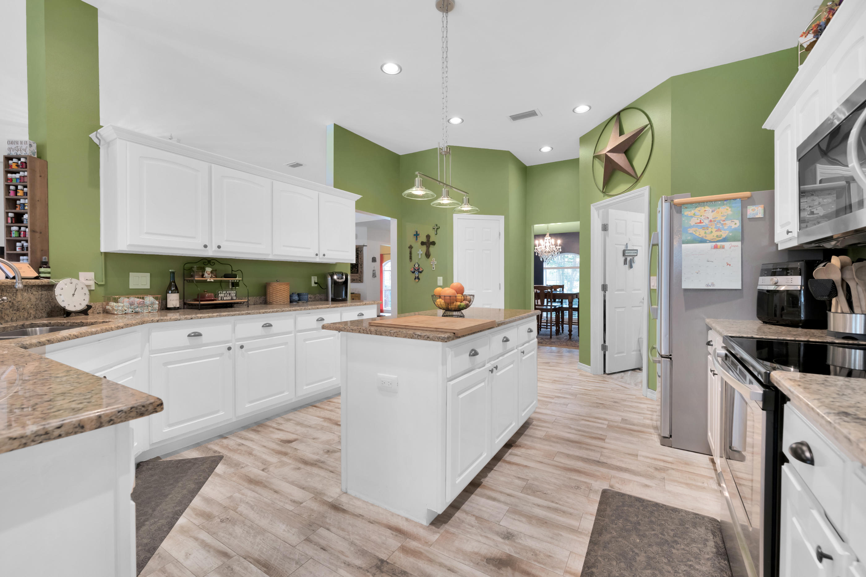 7159 Riverview Road Navarre, FL 32566 - Photo 16 of 36 a kitchen with stainless steel appliances granite countertop a stove a sink and a refrigerator