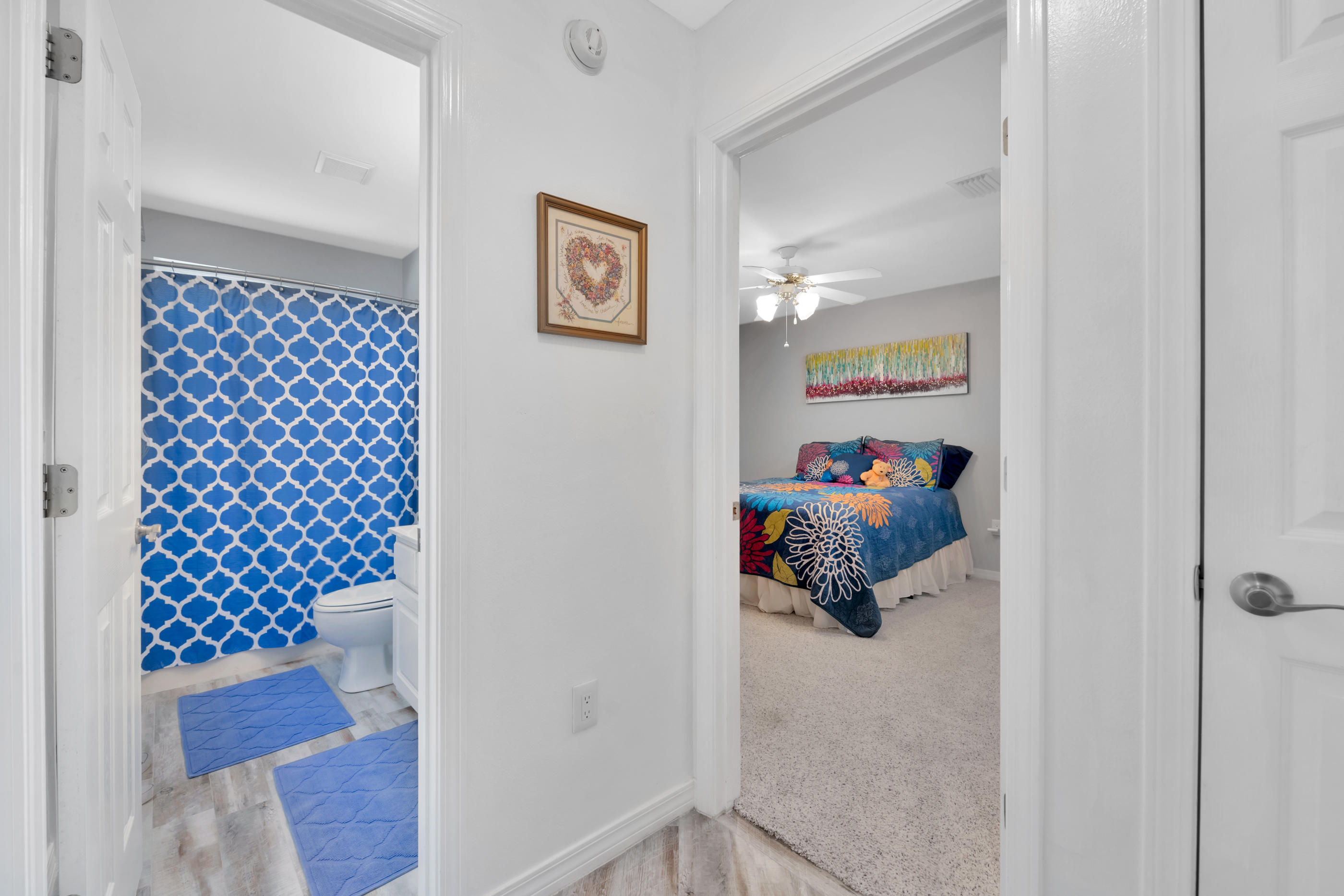 7159 Riverview Road Navarre, FL 32566 - Photo 24 of 36 a hallway with toys and wooden floor