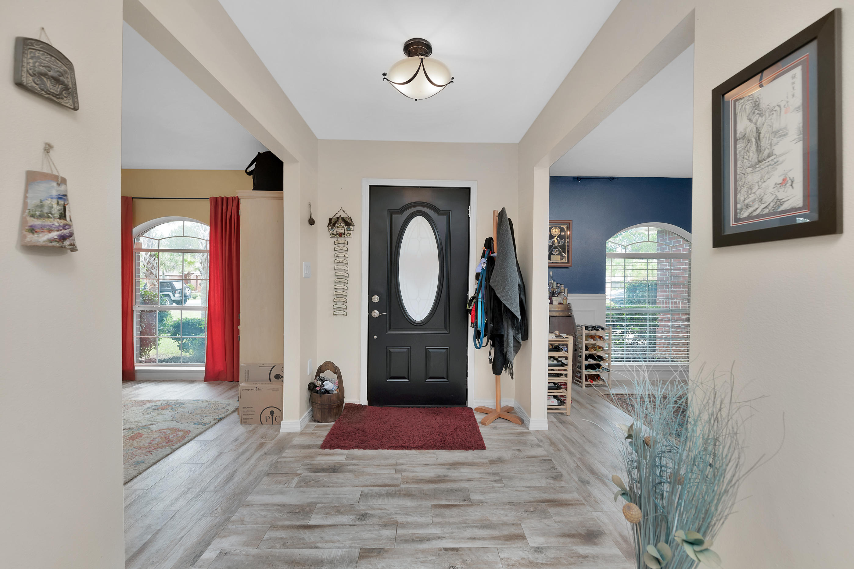7159 Riverview Road Navarre, FL 32566 - Photo 4 of 36 a view of a hallway with windows