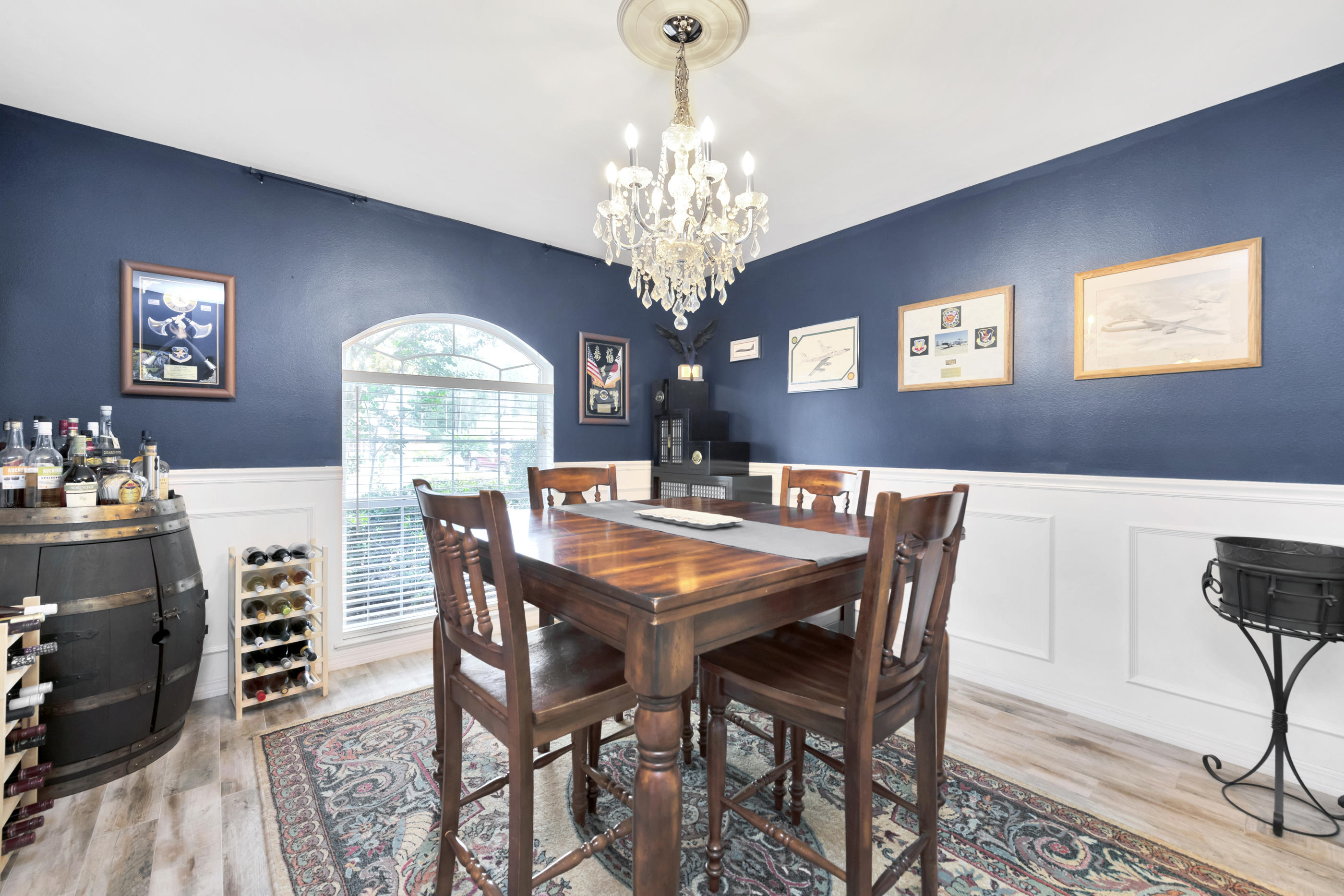 7159 Riverview Road Navarre, FL 32566 - Photo 6 of 36 a dining room with furniture a chandelier and window