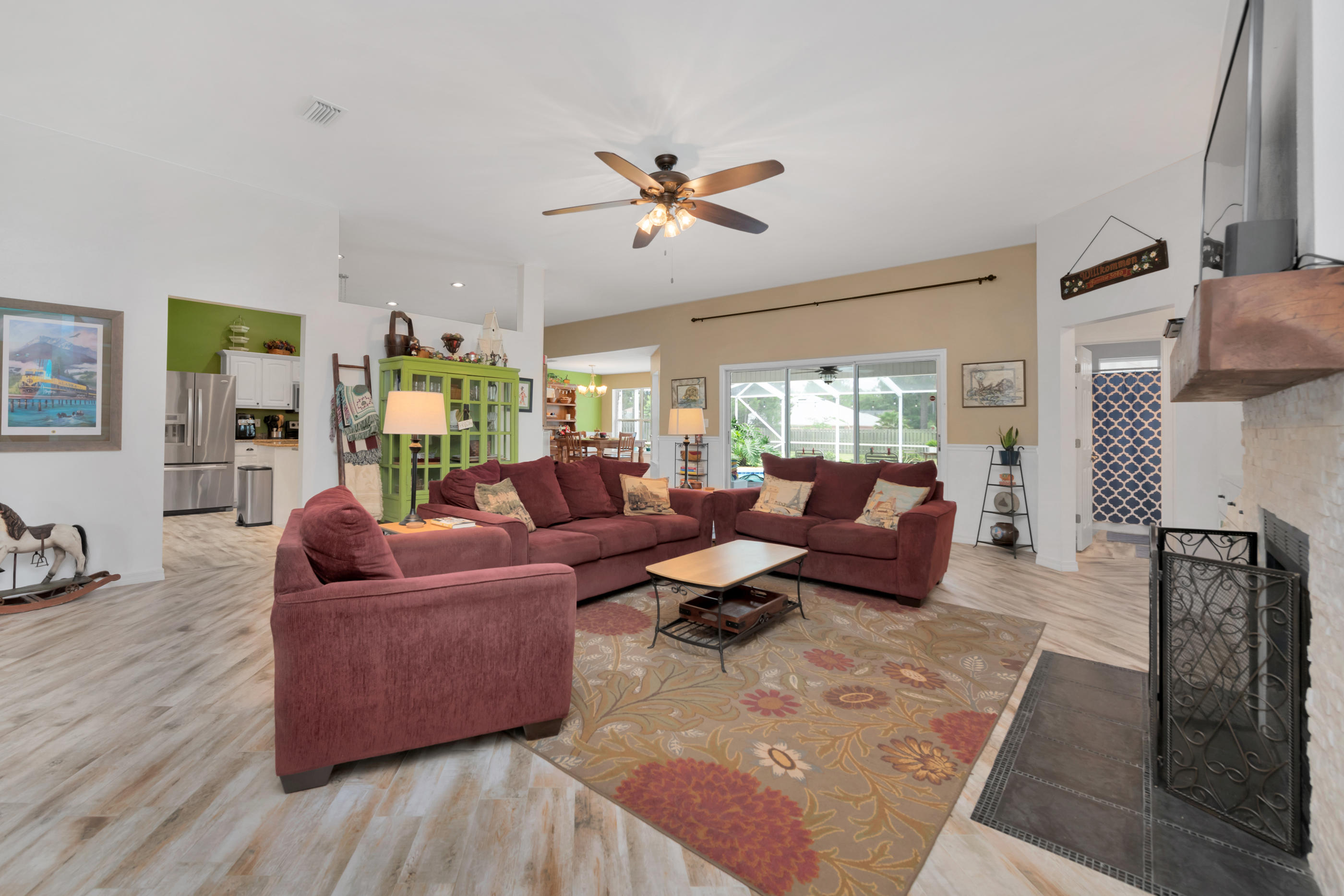 7159 Riverview Road Navarre, FL 32566 - Photo 10 of 36 a living room with furniture and a large window