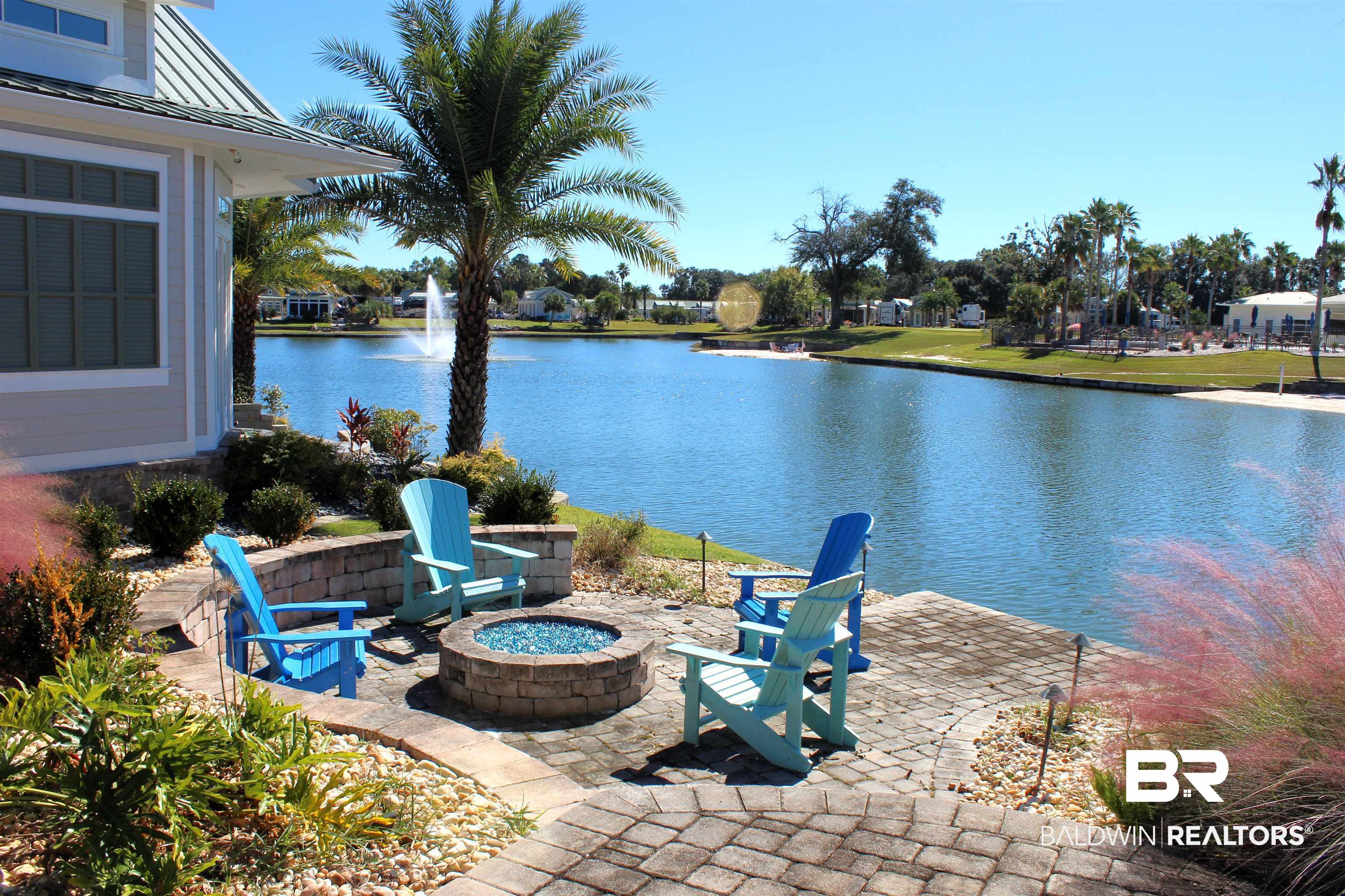 28152 Migratory Way Elberta, AL 36530 - Photo 1 of 54 View of patio / terrace featuring a fire pit and a water view