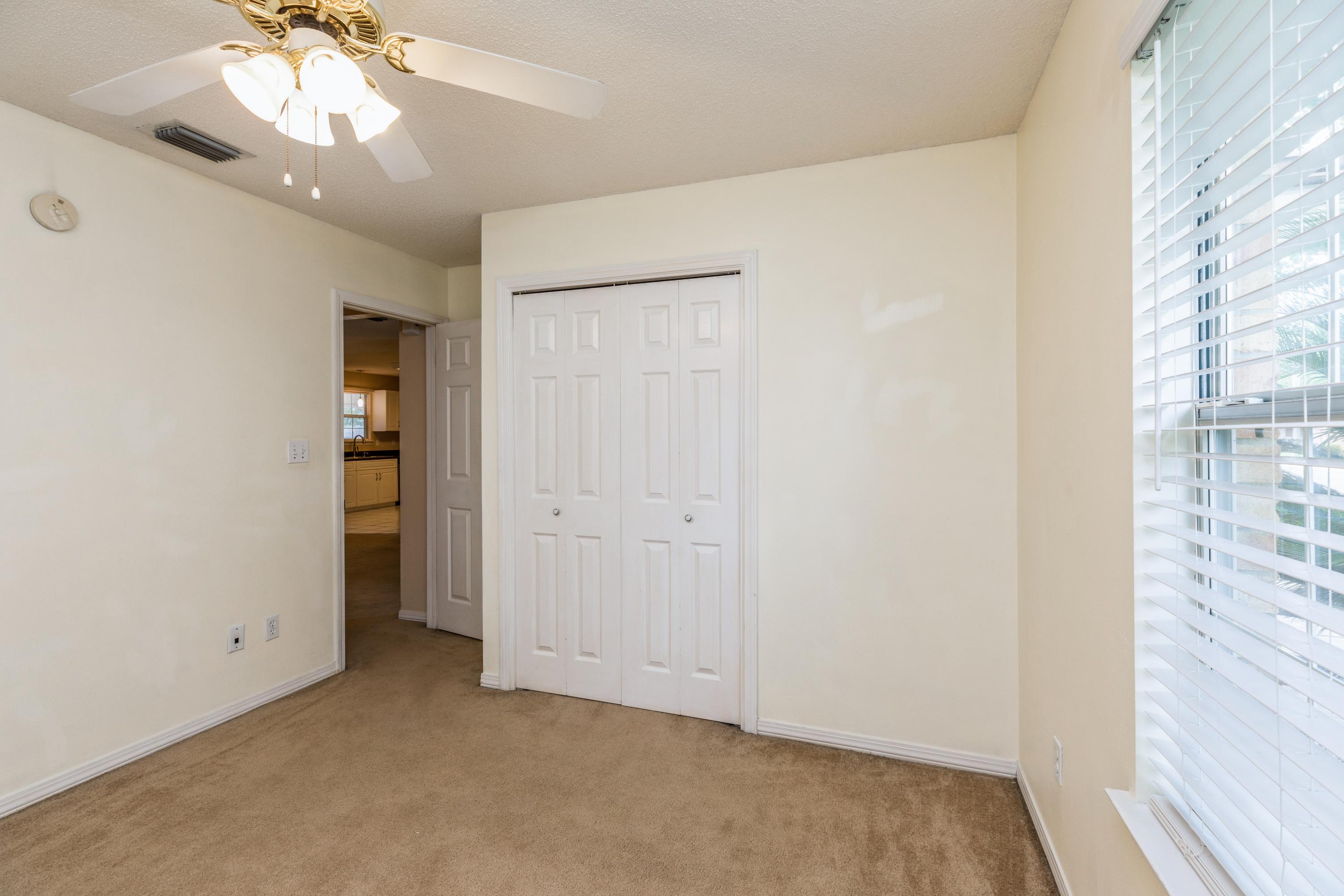 1759 Old Ranch Road Fort Walton Beach, FL 32547 - Photo 22 of 33 wooden floor in an empty room with a window