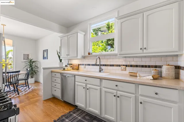 a kitchen with sink cabinets and outdoor view