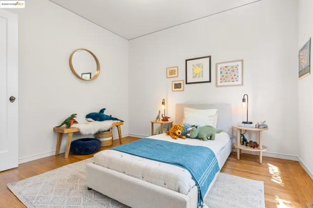 a bedroom with bed and a table