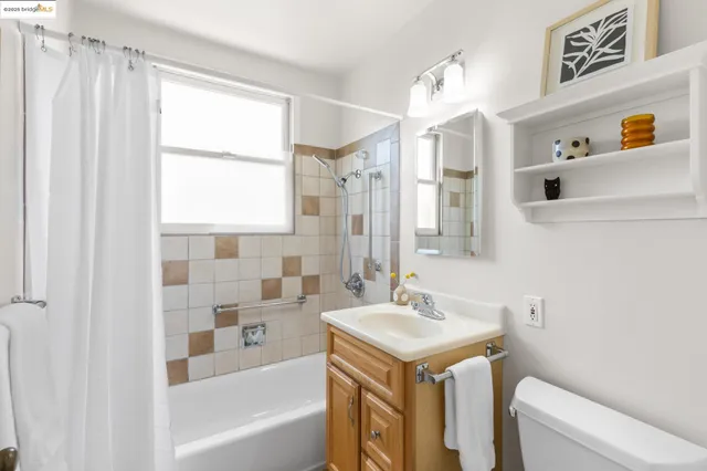 a bathroom with a sink a toilet and a bathtub