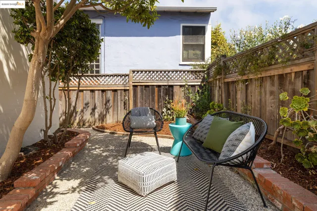 a view of balcony with furniture and a potted plant