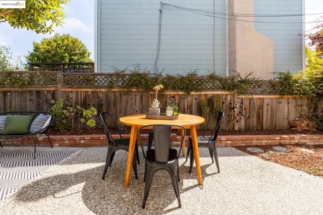 a patio with table and chairs