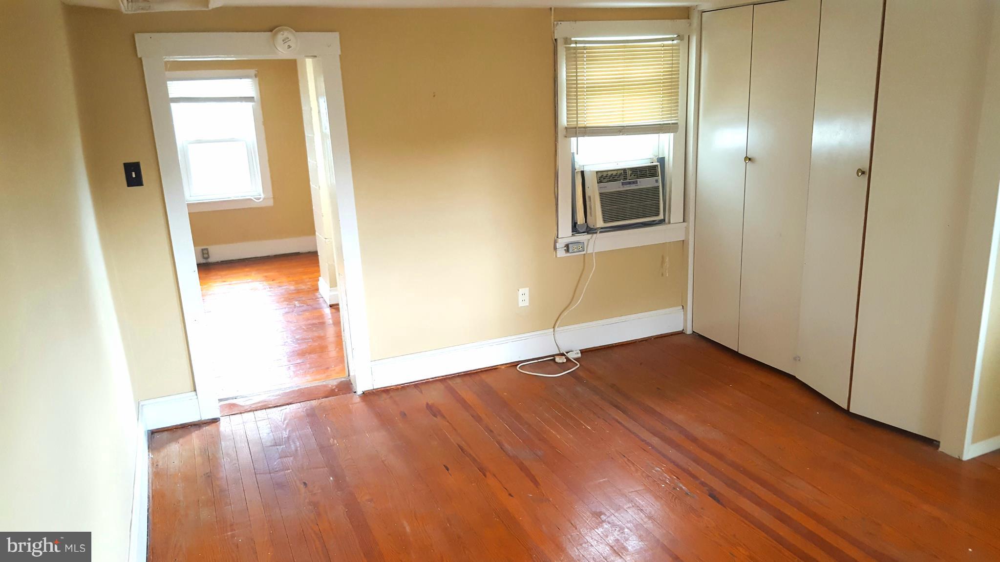 534 Punch Run Road Front Royal, VA 22630 - Photo 11 of 27 a view of an empty room with wooden floor and a window