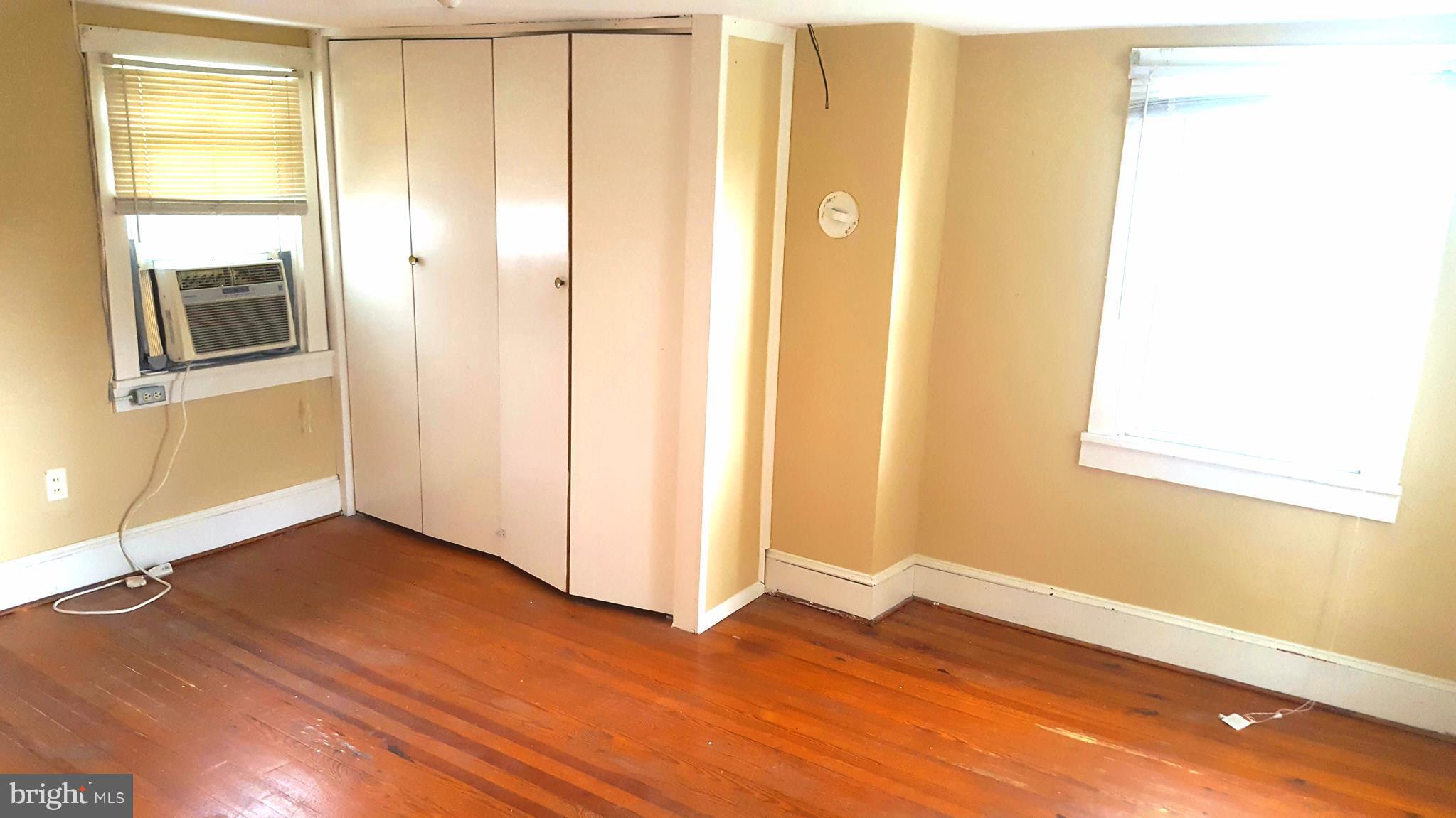 534 Punch Run Road Front Royal, VA 22630 - Photo 12 of 27 a view of an empty room with wooden floor and a window