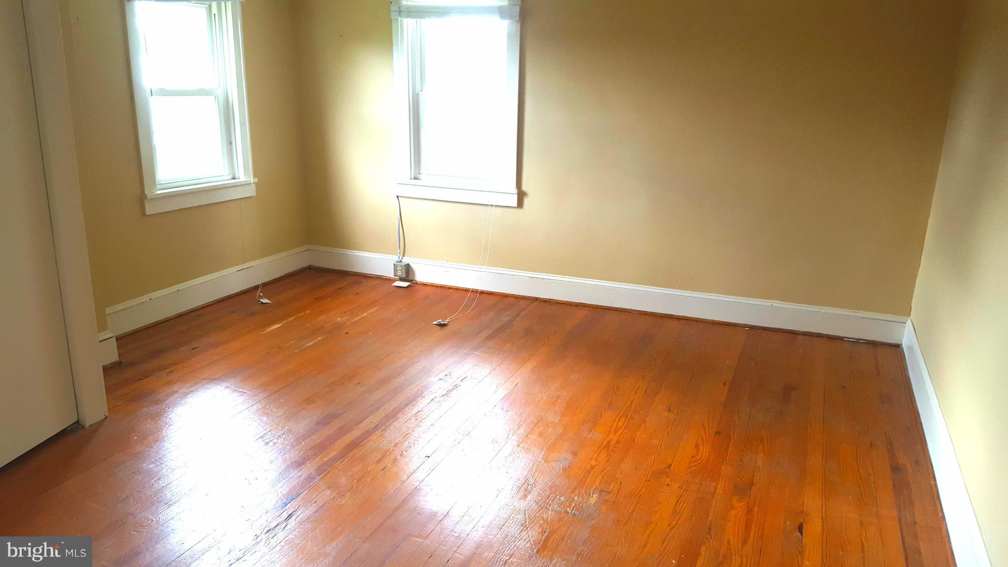 534 Punch Run Road Front Royal, VA 22630 - Photo 13 of 27 a view of empty room with wooden floor and fan