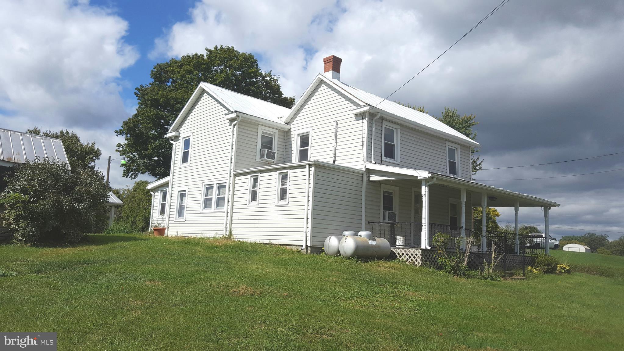 534 Punch Run Road Front Royal, VA 22630 - Photo 25 of 27 a front view of a house with a garden