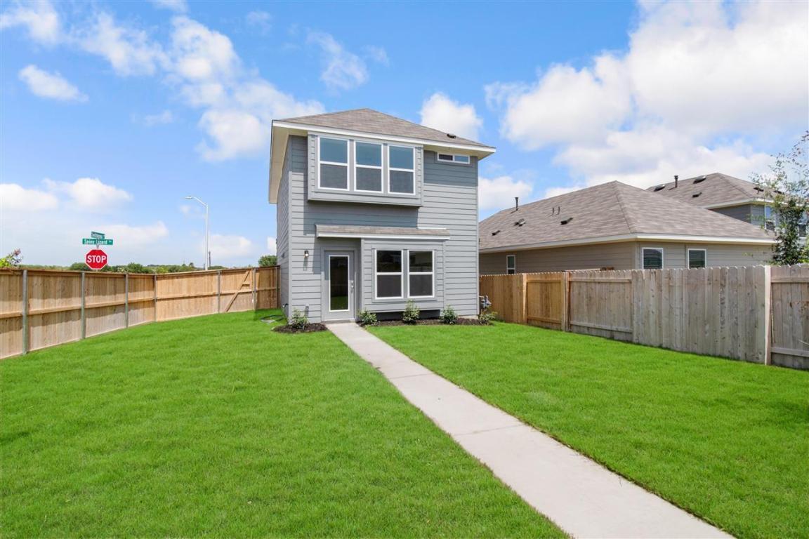404 Spiny Lizard Lane San Marcos, TX 78666 - Photo 16 of 28 a view of a house with backyard and garden