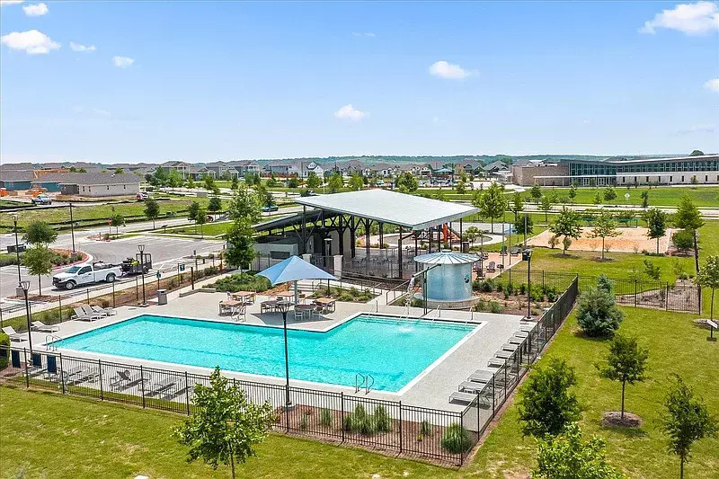 404 Spiny Lizard Lane San Marcos, TX 78666 - Photo 27 of 28 a view of a swimming pool with an outdoor seating