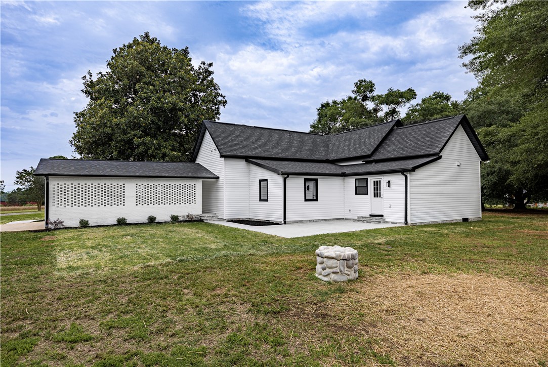 2817 Broadway Lake Road Anderson, SC 29621 - Photo 6 of 41 White siding and a striking black roof create a sharp profile for this inviting property.
