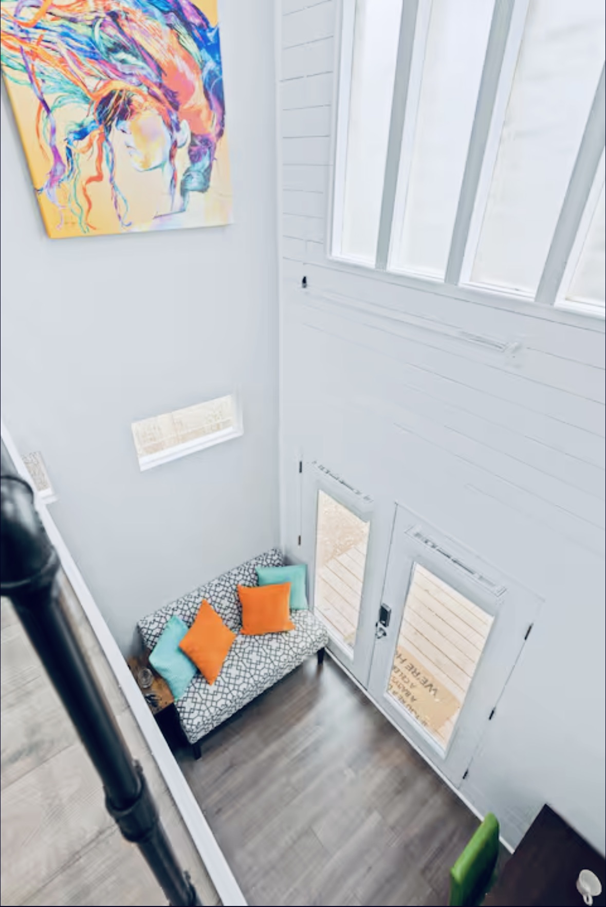 307 East 35th Street, Unit A Austin, TX 78705 - Photo 26 of 31 A spacious, naturally illuminated room features high ceilings and a door leading to an outdoor deck.